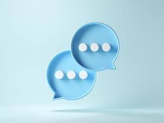 interlinked light blue speech bubbles with three white dots